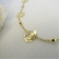 Colar Longo com Bolinha e Flor Banhado em Ouro 18k - Dourado