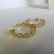 Brinco Argola Média com Vazados Ovais Banhado em Ouro 18k - Dourado