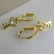 Brinco Argolinha com Chave Banhado em Ouro 18k - Dourado
