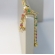 Brinco Corrente de Zircônias Coloridas Sortidas Com Zircônia na Ponta Banhado em Ouro 18k - Dourado