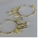 Brinco Argola Médio com Pingente Esotéricos Banhado em Ouro 18k - Dourado