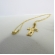 Colar com Pingente de Cruz e Face de Jesus Banhado em Ouro 18k - Dourado